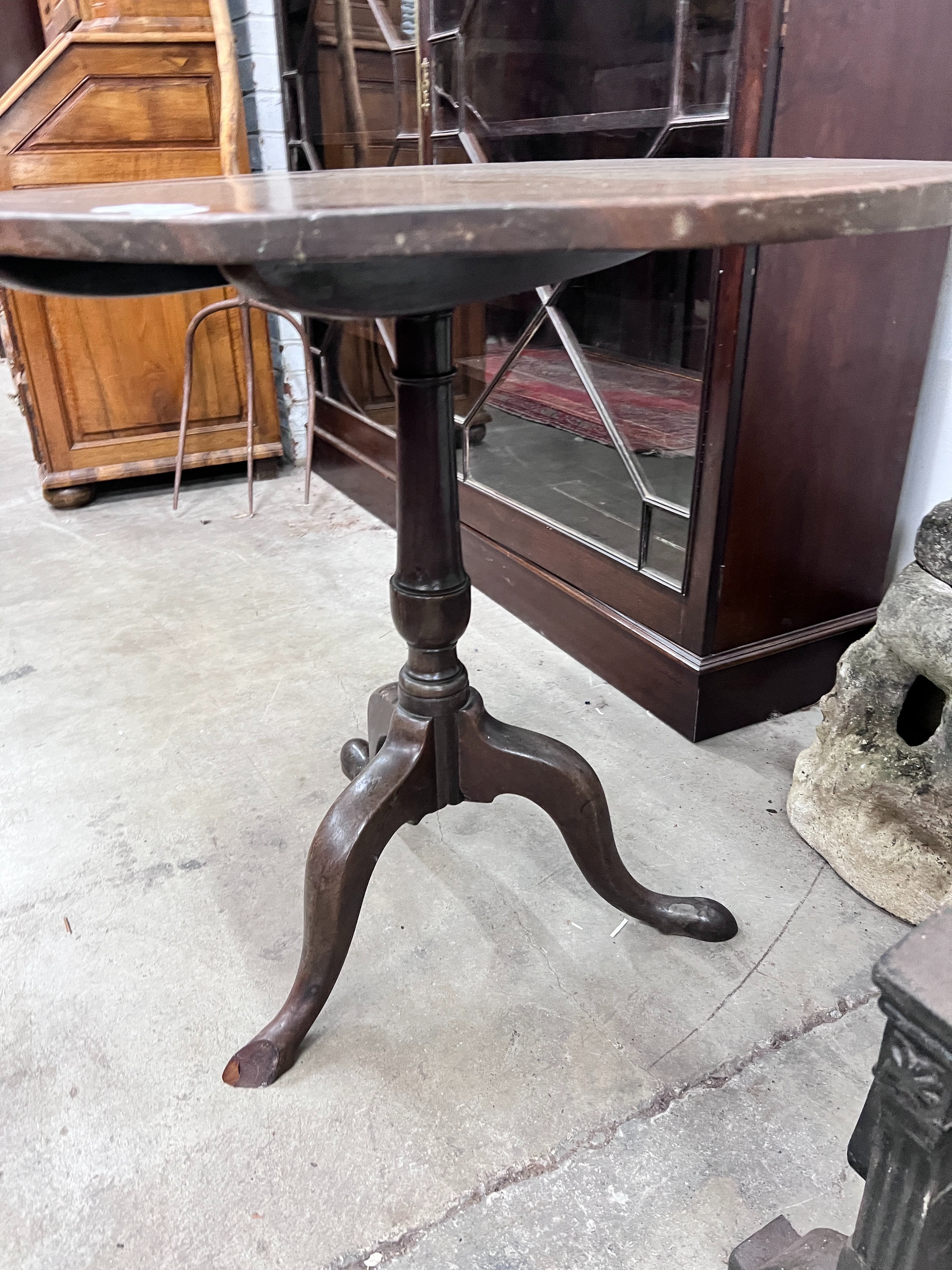 A George III oval top tilt top tripod tea table, width 79cm, depth 65cm, height 71cm *Please note the sale commences at 9am.